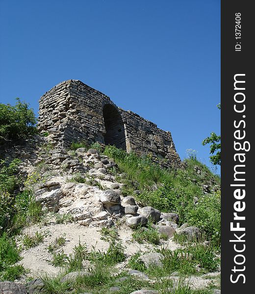 Stones and ruins on a background of the blue sky. 
The State Open-Air Museum Staraya Ladoga. Russia. Stones and ruins on a background of the blue sky. 
The State Open-Air Museum Staraya Ladoga. Russia.