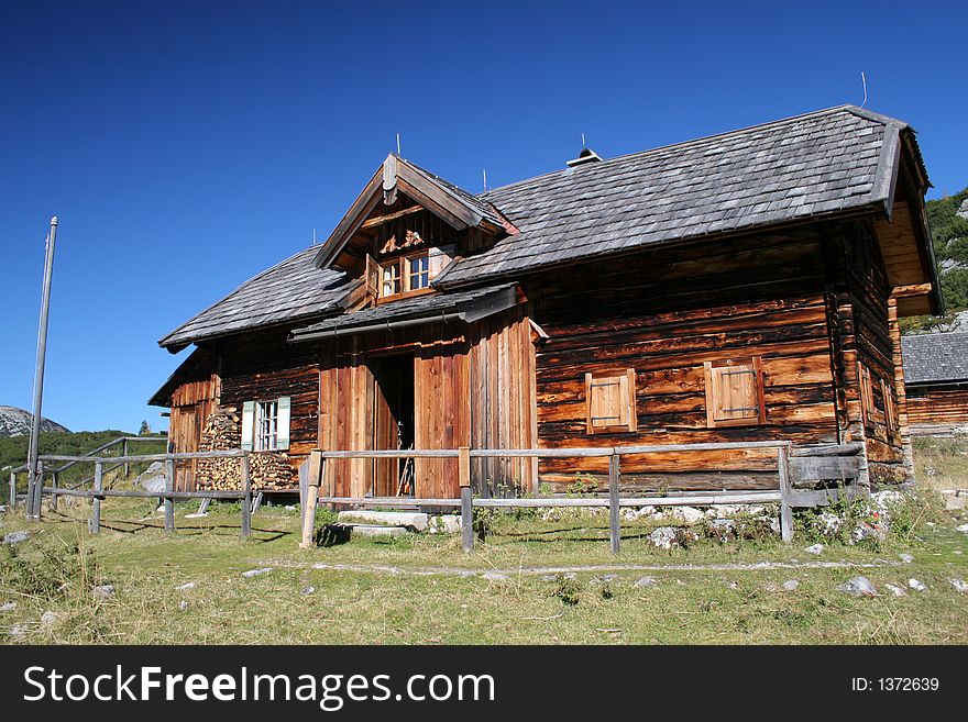 Old log cabin in the mountains