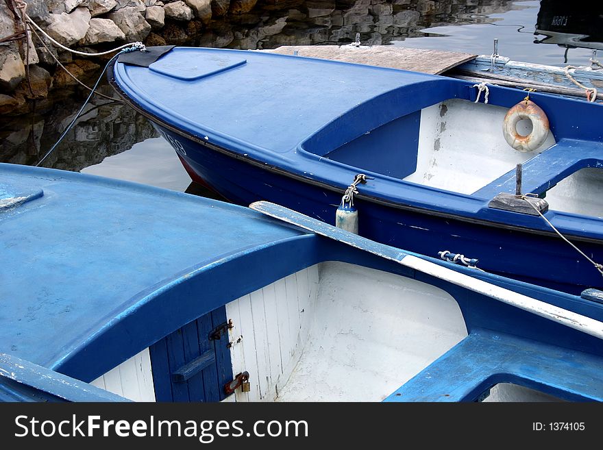 Two blue boats waiting for fishermen. Two blue boats waiting for fishermen