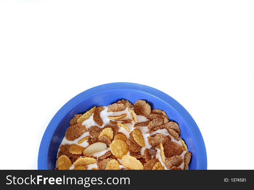 Breakfas cereal on a blue bowl isolated over white background. Breakfas cereal on a blue bowl isolated over white background