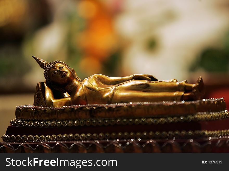 A Sleeping Buddha statue is on display at a temple.