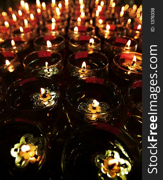 Oil lamps are on display as Buddhist devotees recite prayers on Vesak Day.