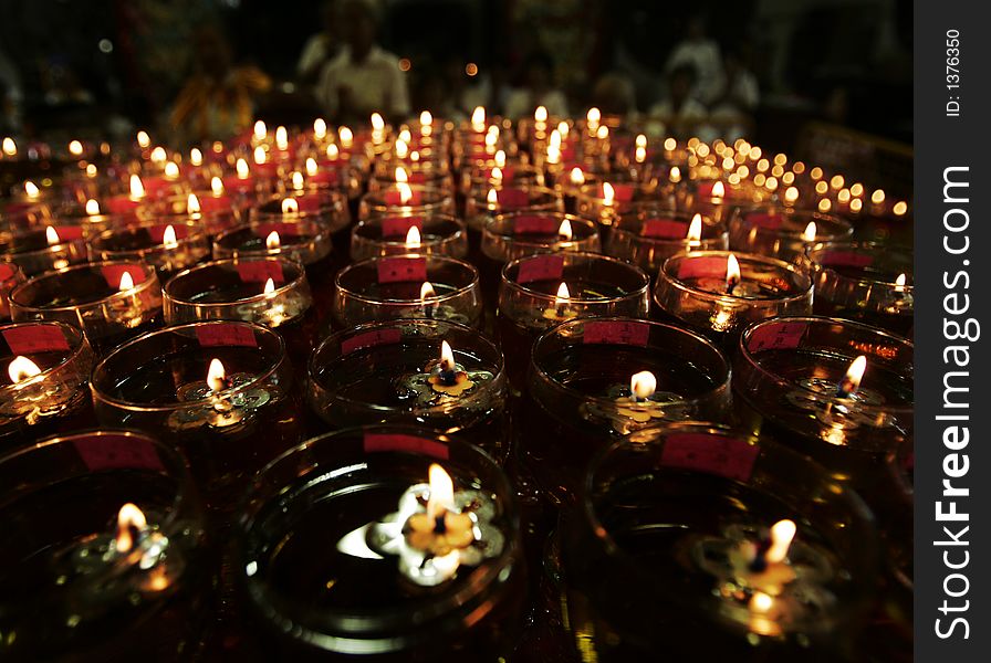 Oil lamps are on display as Buddhist devotees recite prayers on Vesak Day.