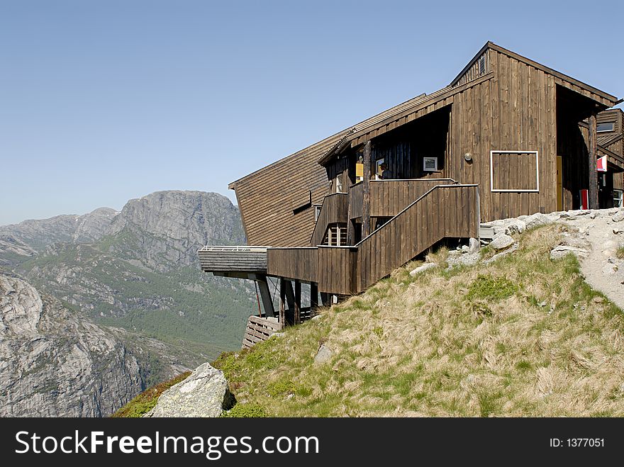 Picture of cottage on the edge of rock wall in Lysefjord, Norway.