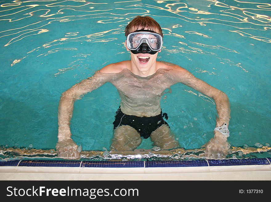 Happy man with mask in pool. Happy man with mask in pool