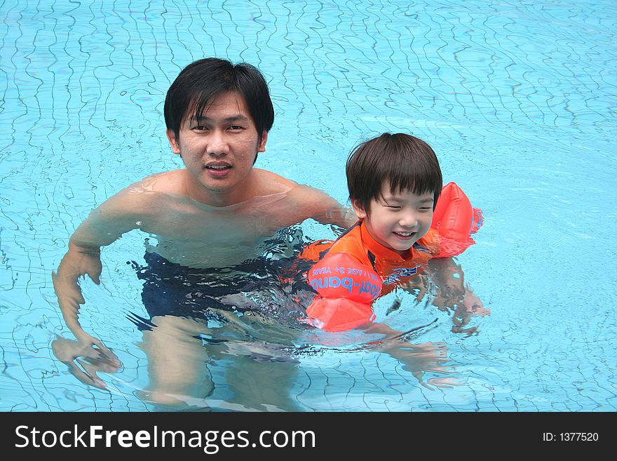 Man & Boy In The Pool