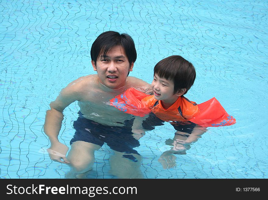 Man & Boy In The Pool