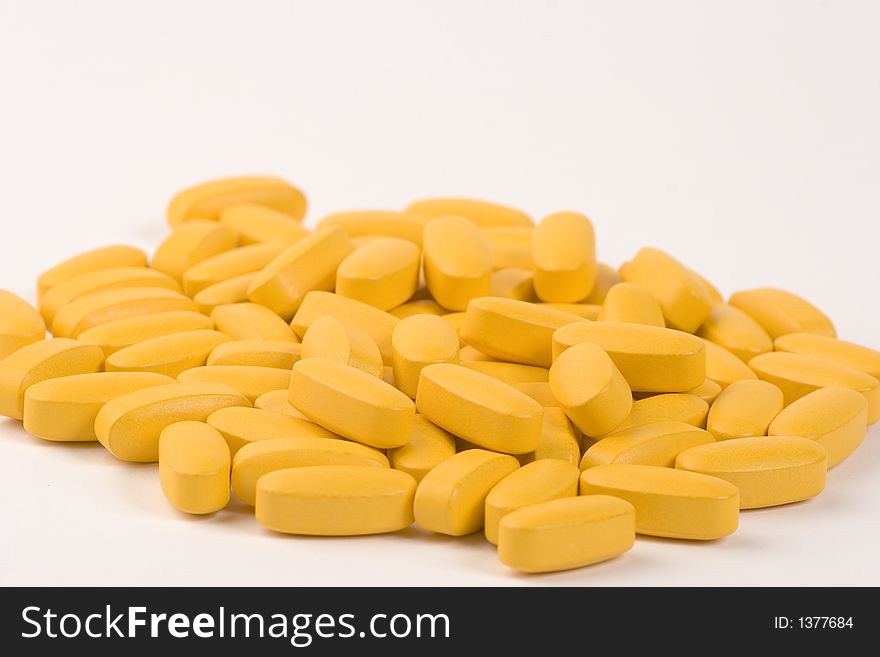 Multiple pills against a white background.