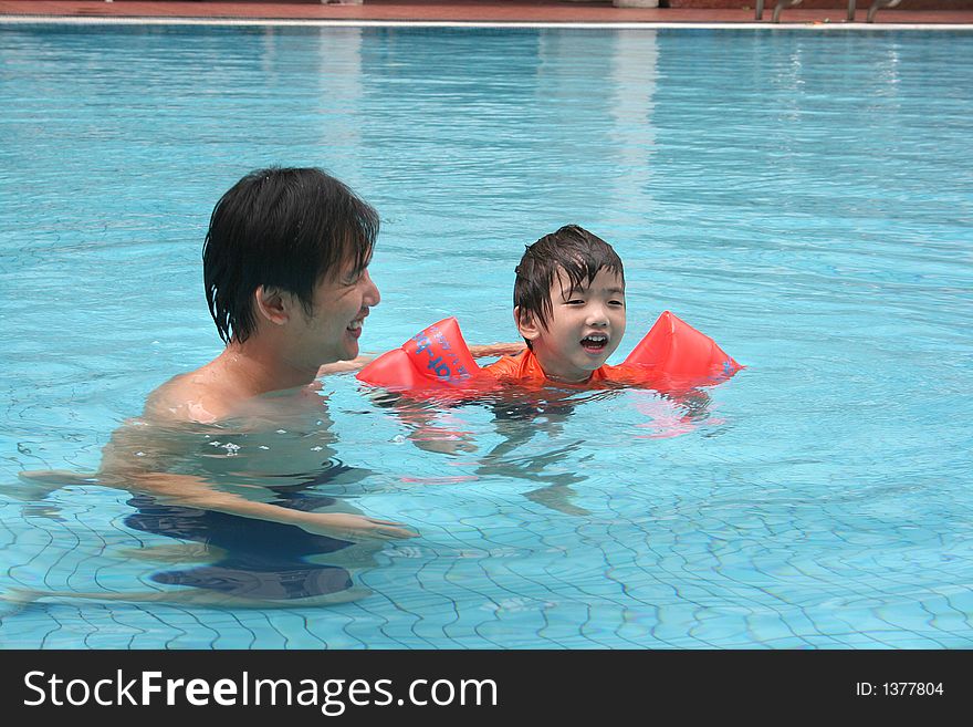 Man & boy in the pool