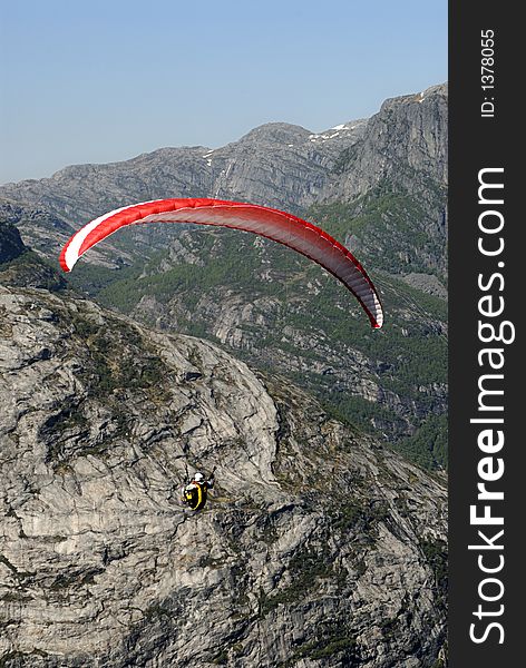 Picture of paraglider flying over Lysefjord in Norway. Picture of paraglider flying over Lysefjord in Norway.