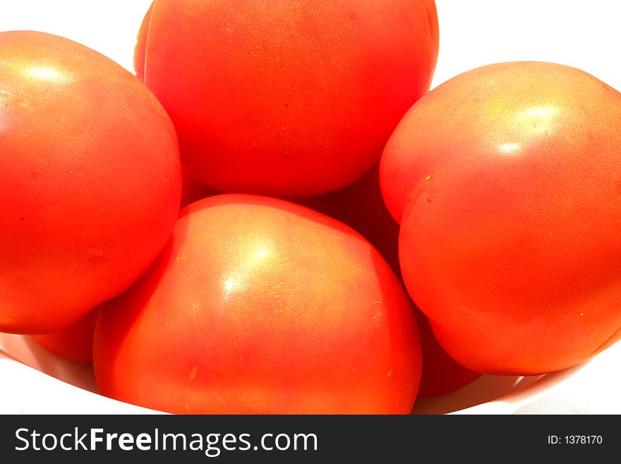 Ripe red tomatoes in white bowl on white background. Ripe red tomatoes in white bowl on white background