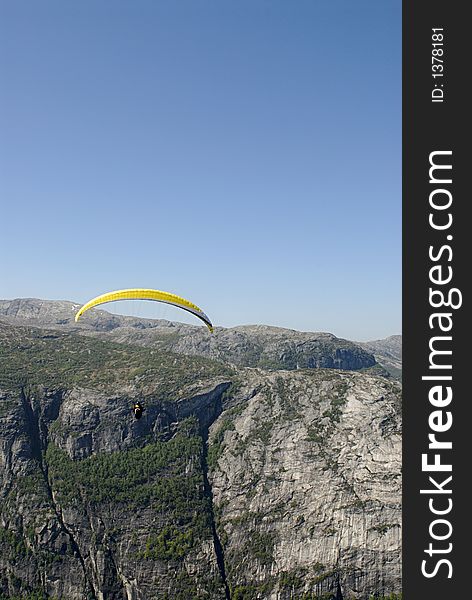 Picture of paraglider flying over Lysefjord in Norway. Picture of paraglider flying over Lysefjord in Norway.