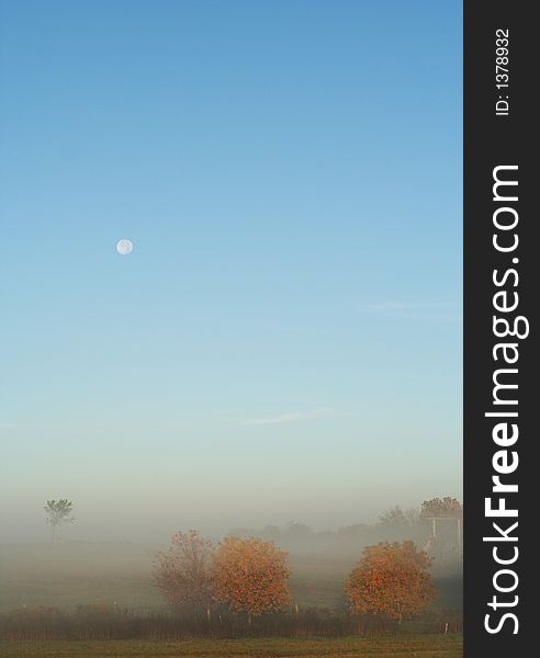 Foggy farm landscape, breathtaking view of the fields in the early morning