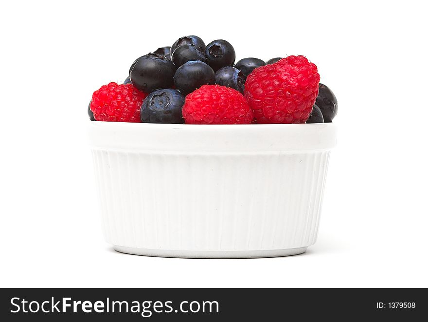 Raspberries and blueberries in a bowl. Raspberries and blueberries in a bowl