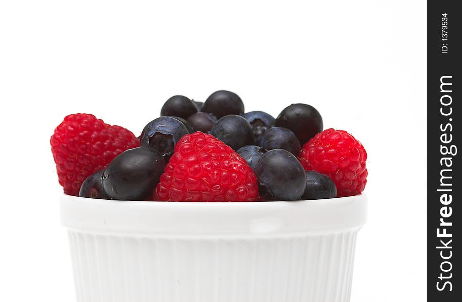 Raspberries and blueberries in a bowl. Raspberries and blueberries in a bowl