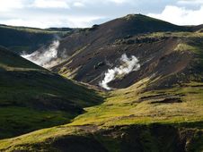 Steaming River, Black Lava Mountains And Sheep In Stock Images Steaming River, Black Lava Mountains And Sheep In Stock Images