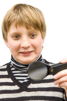 A Boy And A Magnifying Glass Royalty Free Stock Images