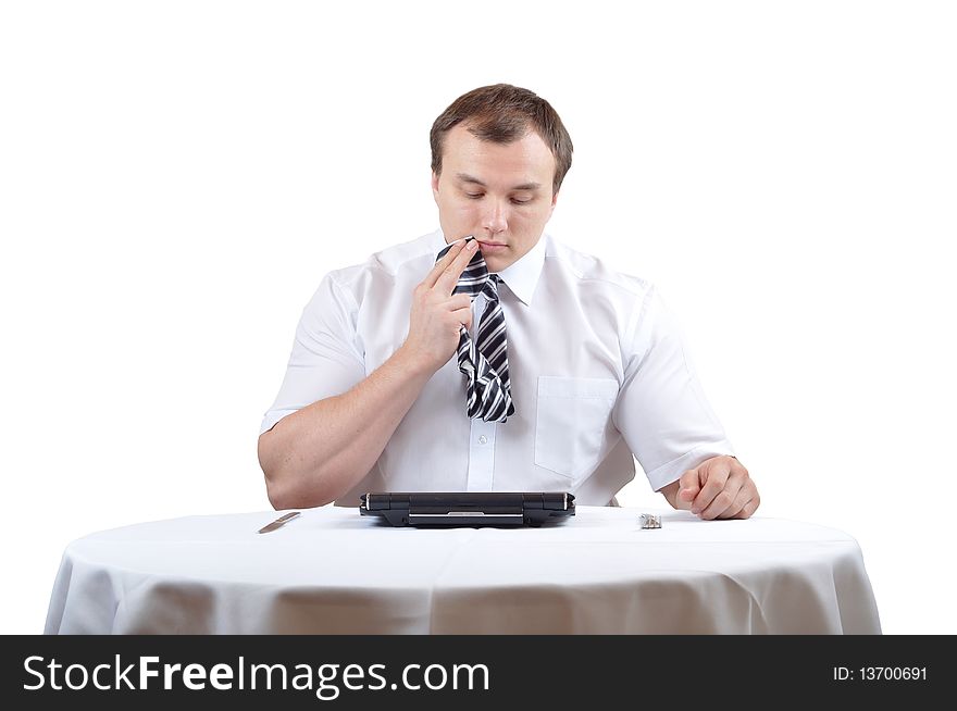 Businessman is wiping mounth with tie after lunch. Businessman is wiping mounth with tie after lunch
