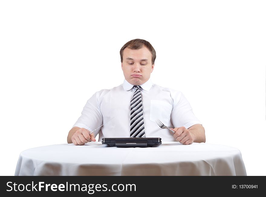 Businessman is blowing after lunch over table with notebook. Businessman is blowing after lunch over table with notebook