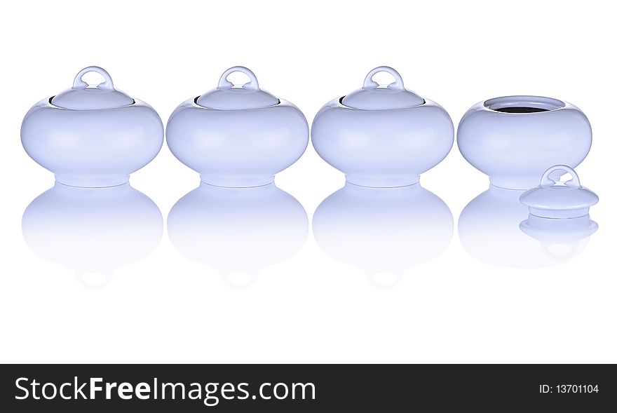 Blue Sugar Bowls In A Row With One Top Off