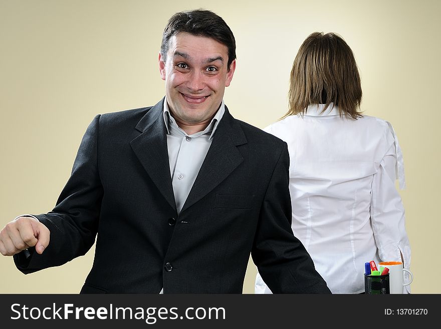 happy business man having fun in office, upset colleague in background