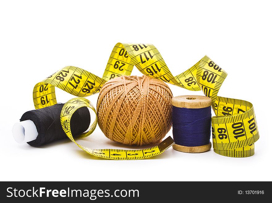Colorful thread with measuring tape isolated in white