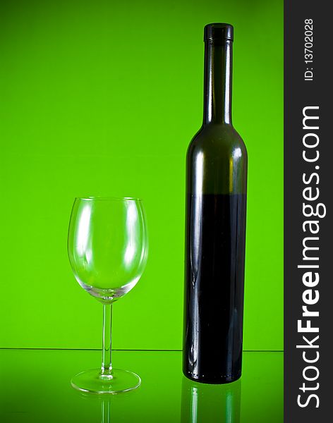 Wine glass on green background