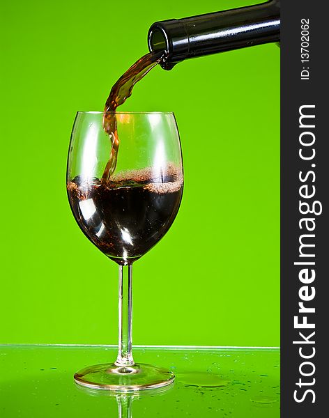 Red wine poured into glass