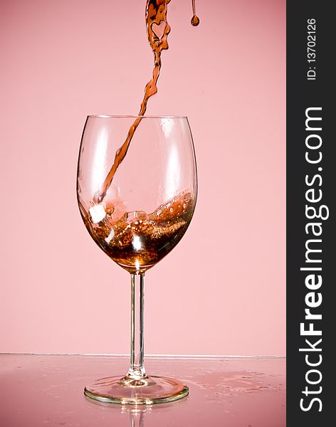 Red wine poured into glass