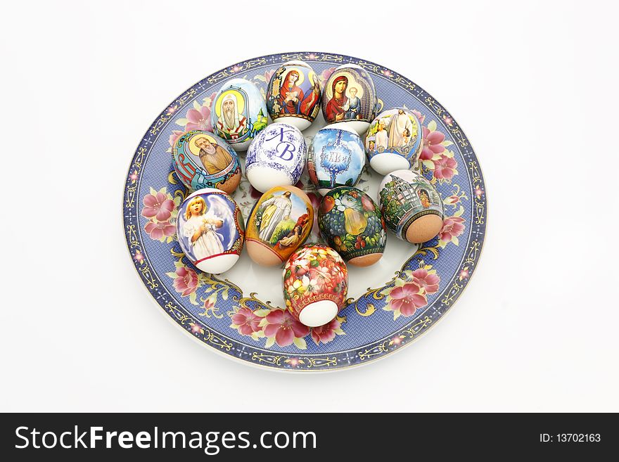 Easter eggs on a plate painted by colors
