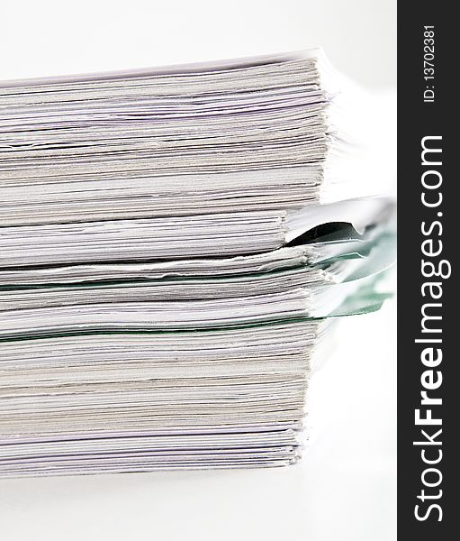 Files stack handled documents for review. Files stack handled documents for review