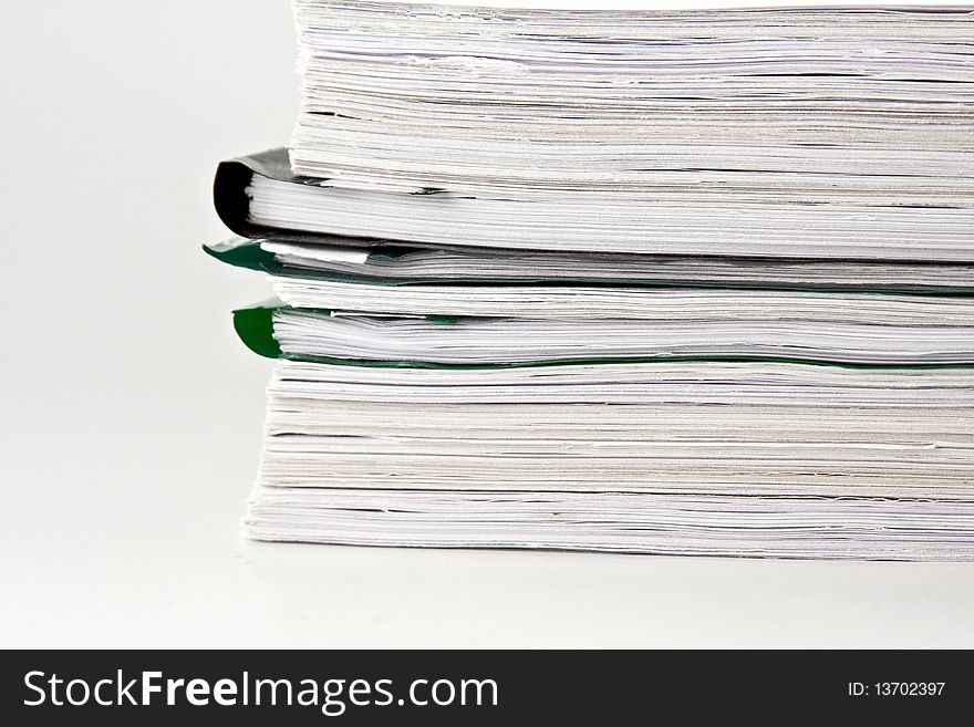 Files stack handled documents for review. Files stack handled documents for review