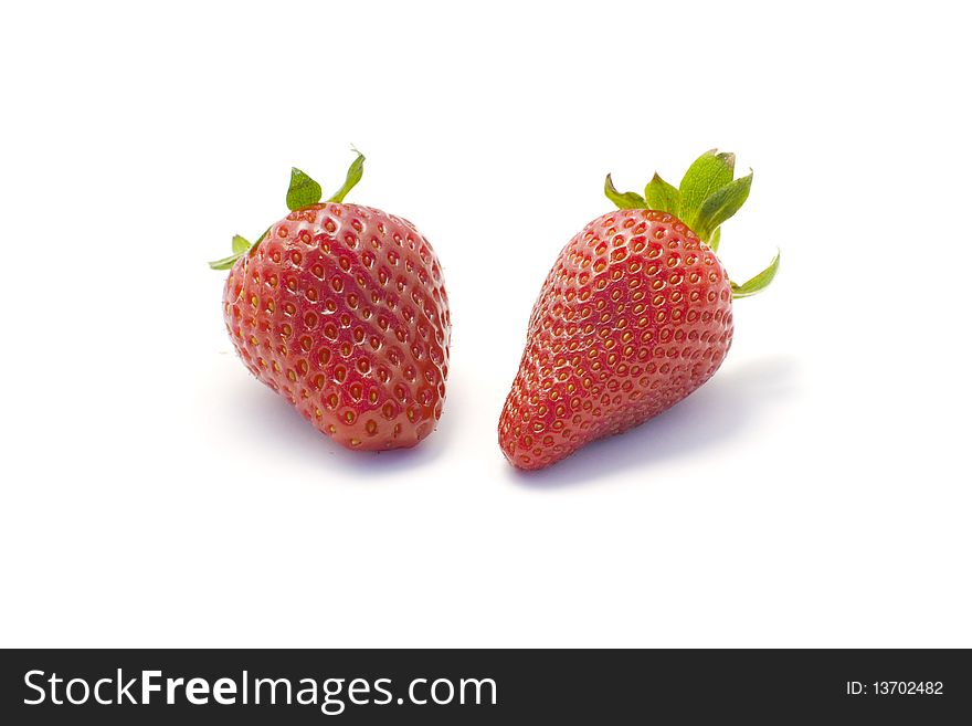 Studio shot of two fruits - strawberries cutout on white background. Studio shot of two fruits - strawberries cutout on white background