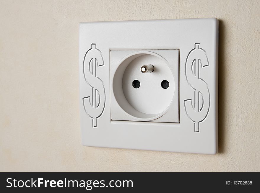 Close-up of white electric socket with dollar symbol. Close-up of white electric socket with dollar symbol