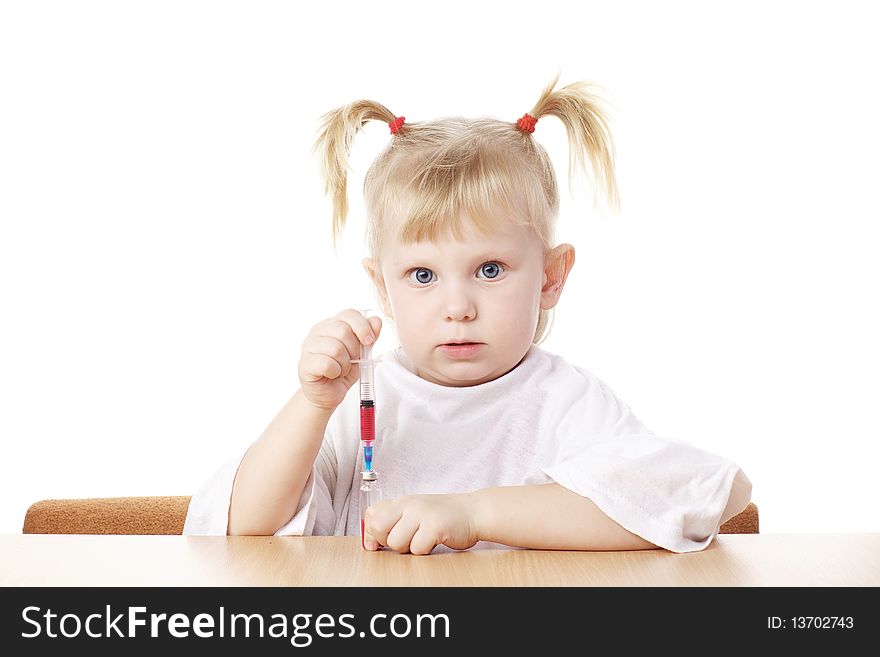 Child playing with a syringe