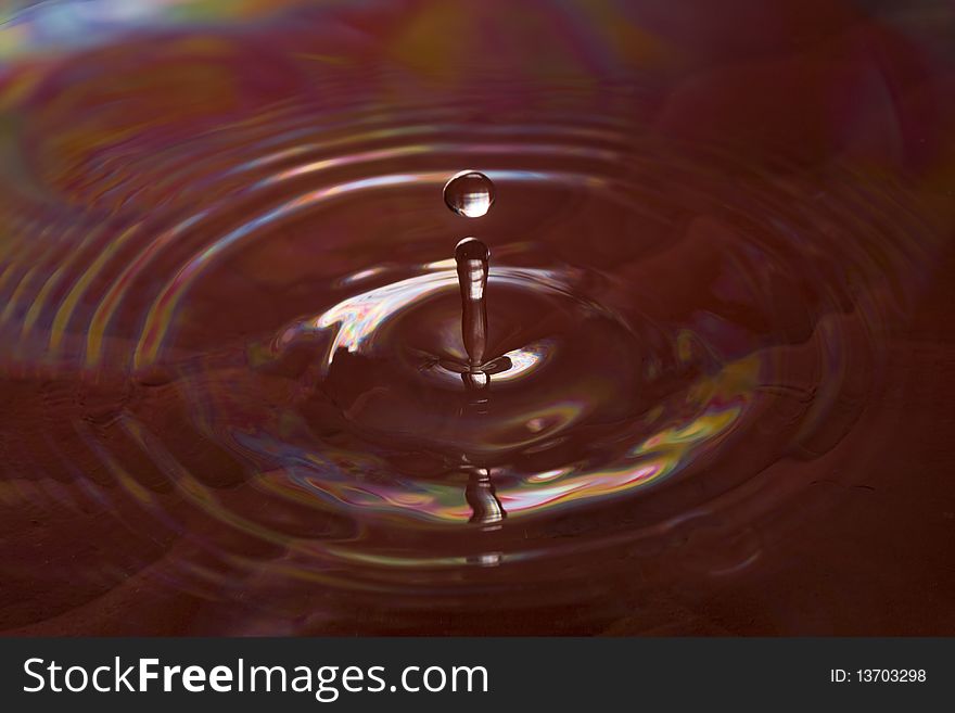 Red water drop with ripples