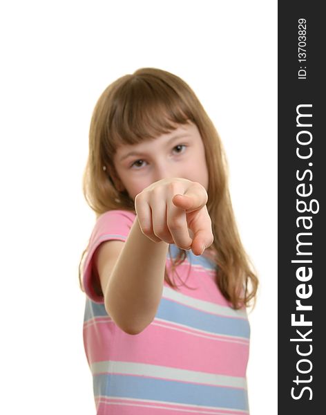 Girl points  finger isolated in white
