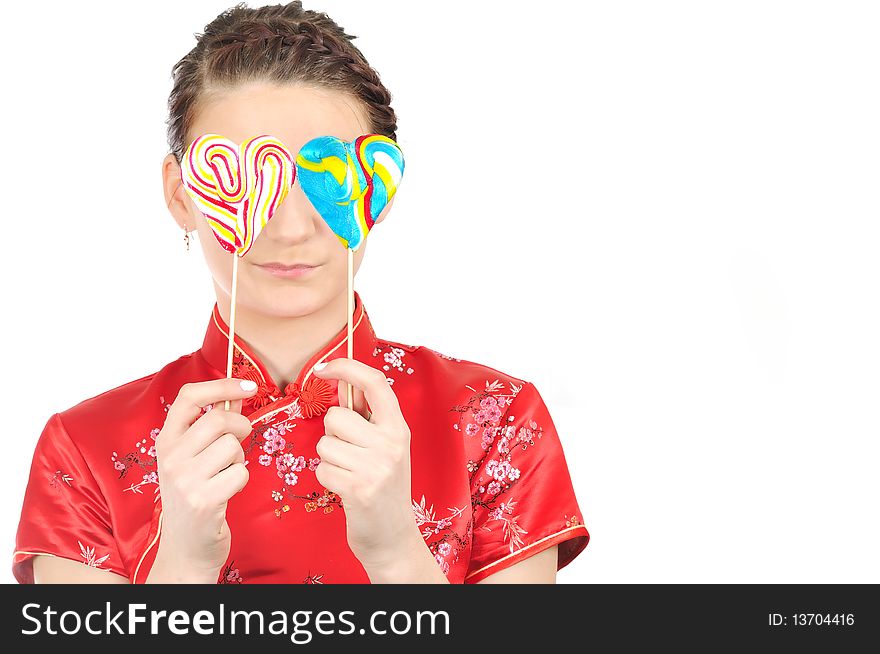 Girl in Chinese dress, with two lollipop,. Girl in Chinese dress, with two lollipop,