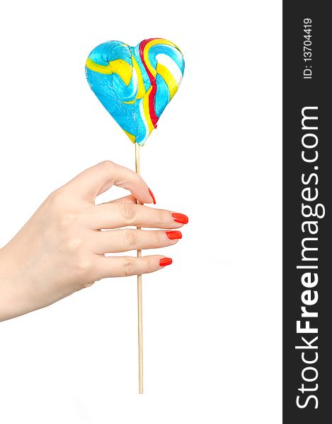 Large colorful lollipop in hand