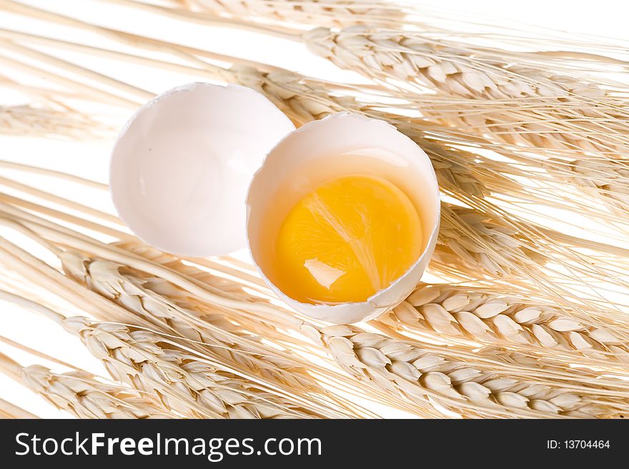 Background with gold wheat and egg