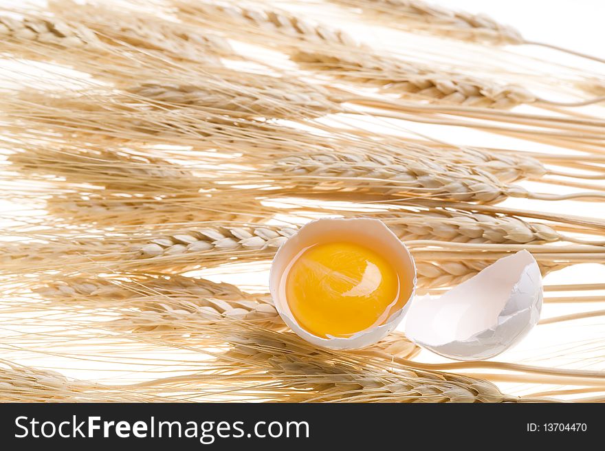 Background with gold wheat and egg