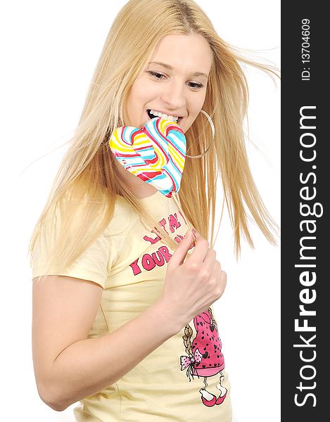 Blondie girl enjoying eating big lollipop