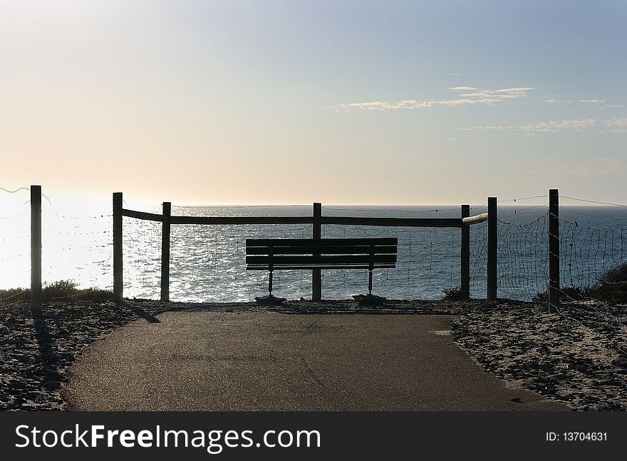 Bench standing on the ocean shore