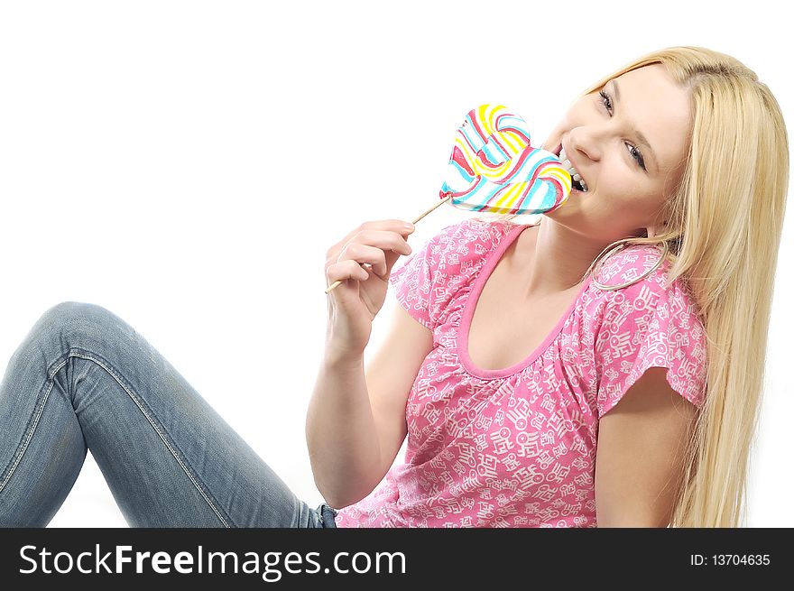 Blodie girl enjoying eating lollipop. Blodie girl enjoying eating lollipop