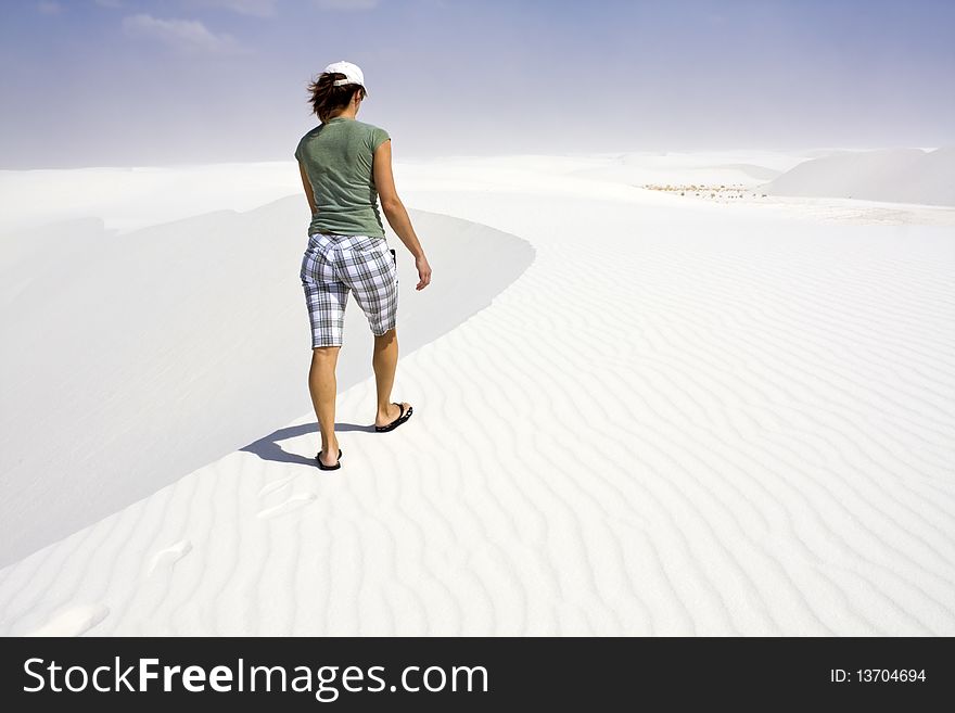 Girl walking dunes - White Sand Dunes National Park. Girl walking dunes - White Sand Dunes National Park