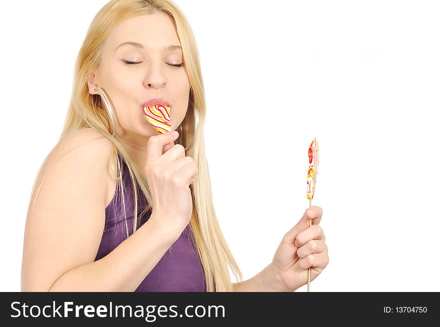 Blondie girl enjoying eating lollipop. Blondie girl enjoying eating lollipop