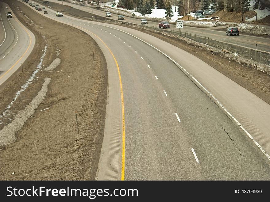 Partially empty freeway seen from above in vail, colorado. Partially empty freeway seen from above in vail, colorado