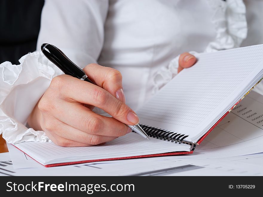 Young businesswoman sign important documents. Young businesswoman sign important documents