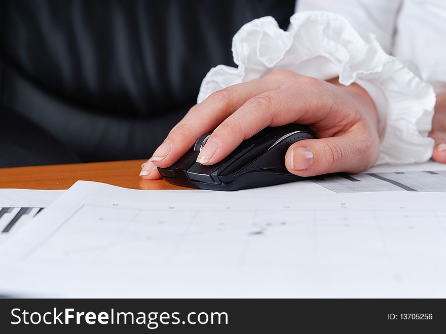 Hands of a young girl working on laptop. Workplace businessman.