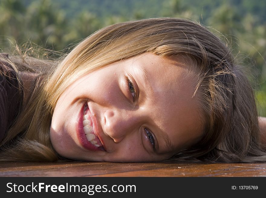 Closeup portrait of charming young girl smiling